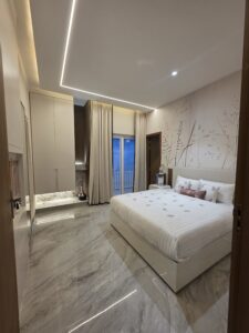 “Modern 3BHK bedroom at Hare Krishna Ashiyana near Prem Mandir offering comfort and spiritual vibes”