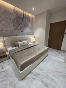 “Comfortable 3rd bedroom at Hare Krishna Ashiyana in Vrindavan with modern design, natural light, and cozy ambiance”